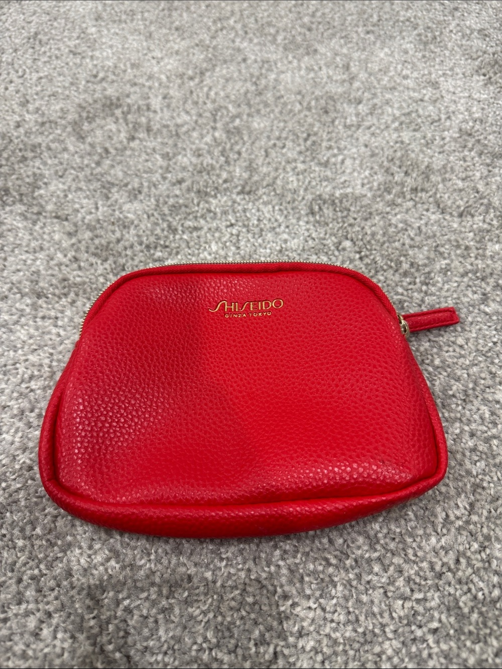 Shiseido Red Pebbled Cosmetic Pouch with Gold Logo